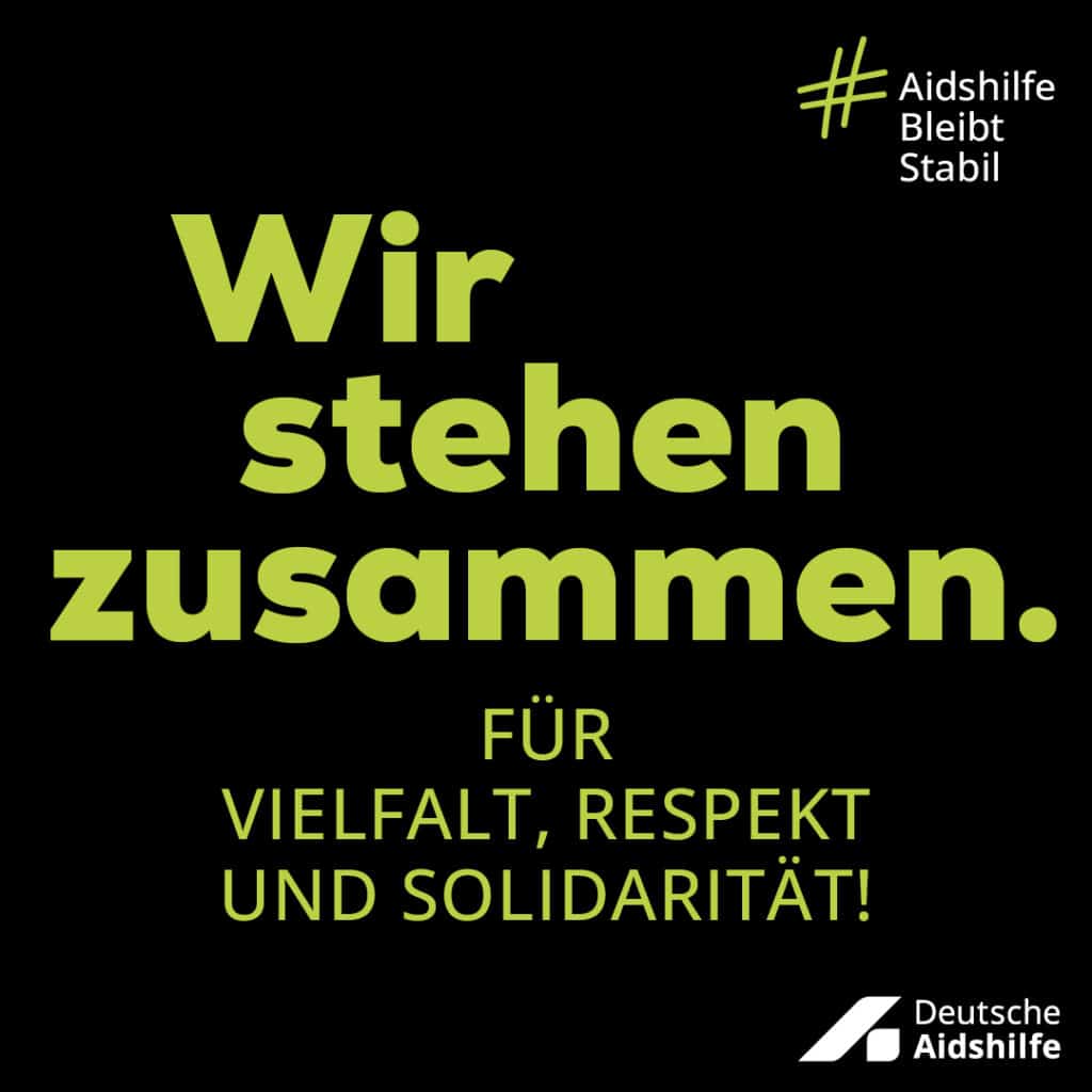 Black campaign motif with the inscription „We stand together. For diversity, respect and solidarity.“
