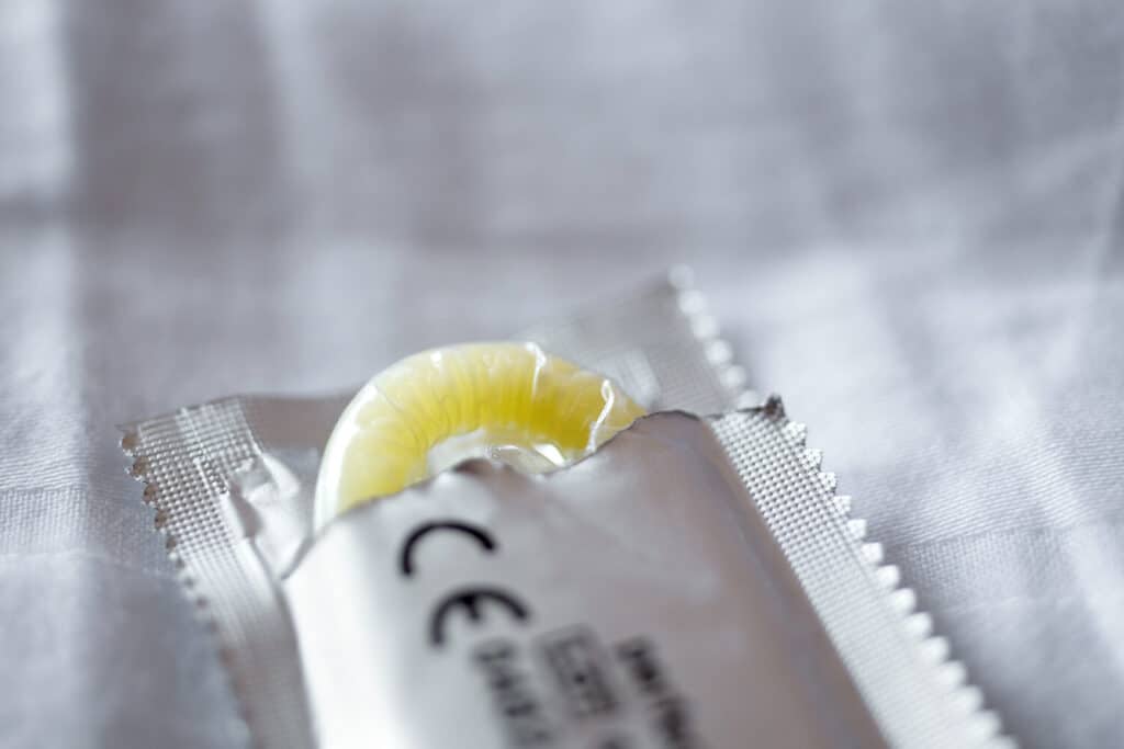 Opened condom packaging with visible CE mark as an indication of tested quality